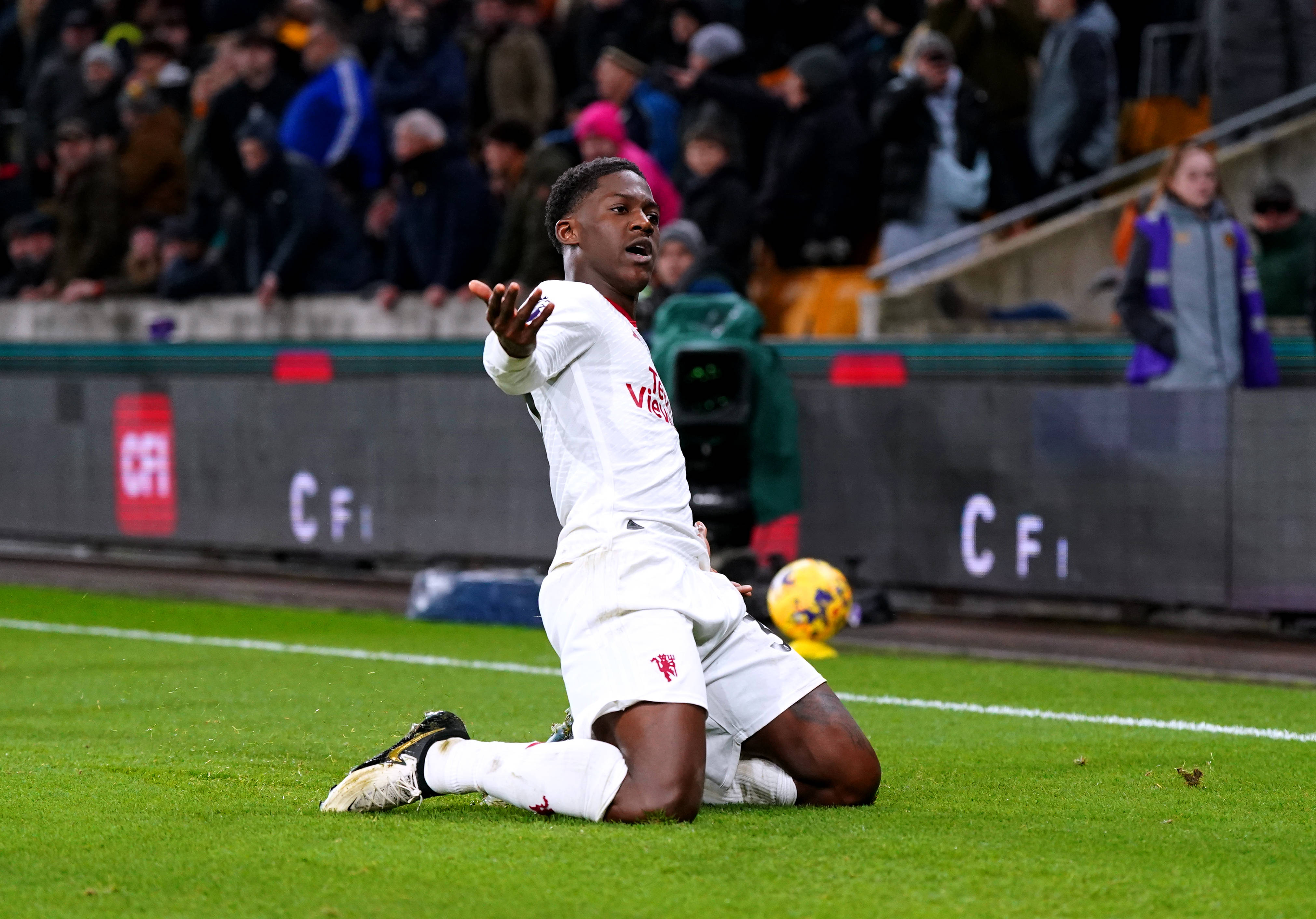 Kobbie Mainoo pictured celebrating after scoring the first goal of his Premier League career to seal a 4-3 win for Manchester United at Wolves in February 2024